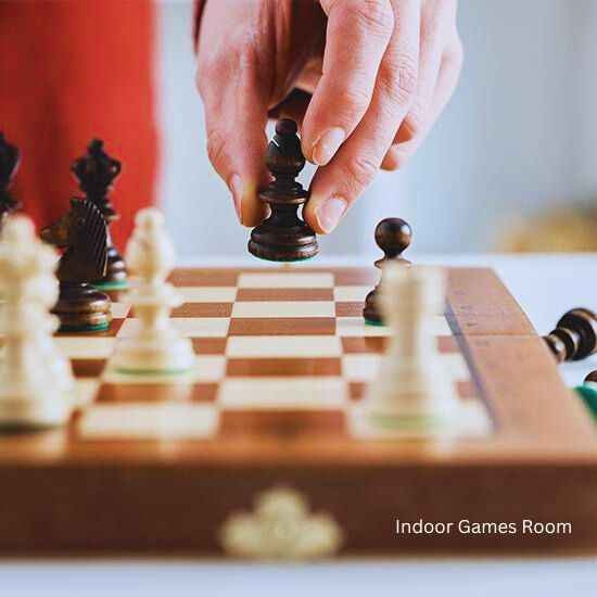 A person playing chess on a board at Godrej Sector 43 Gurgaon .